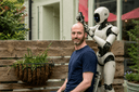 An AI robot shaving Alex's head